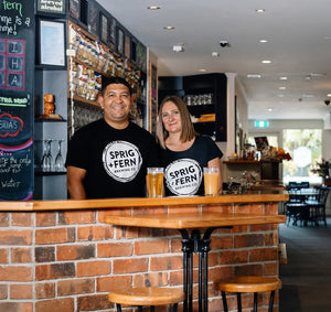 The owners of Sprig + Fern Brightwater, Justin and Barb Frost behind the bar.