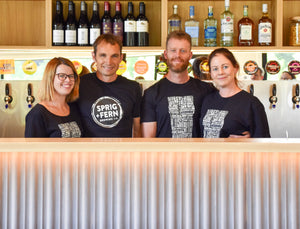 The owners of Sprig + Fern Marsden, Ingrid, Vince, Drew and Amy standing behind the bar.