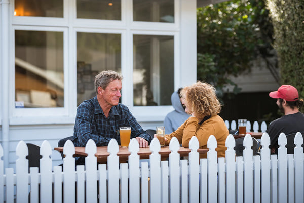 Two patrons enjoying Sprig + Fern beverages at Sprig + Fern Milton Street.