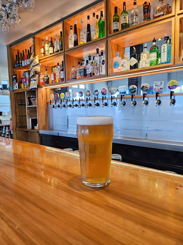 Proper Pint of Sprig + Fern beer on the bar at Sprig + Fern Motueka.