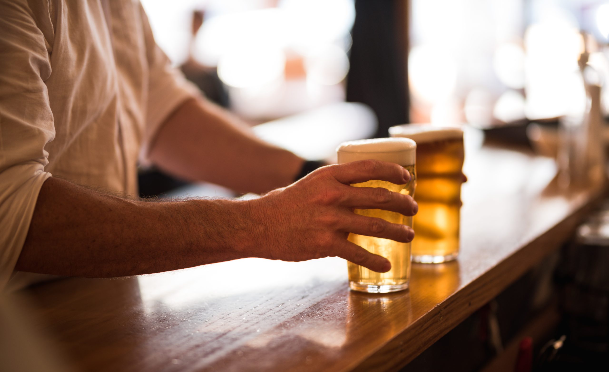 Two pints being served at Sprig and Fern Merivale