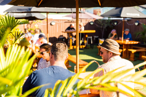 A table of customers enjoying the beer garden of Sprig and Fern Tahuna Tavern
