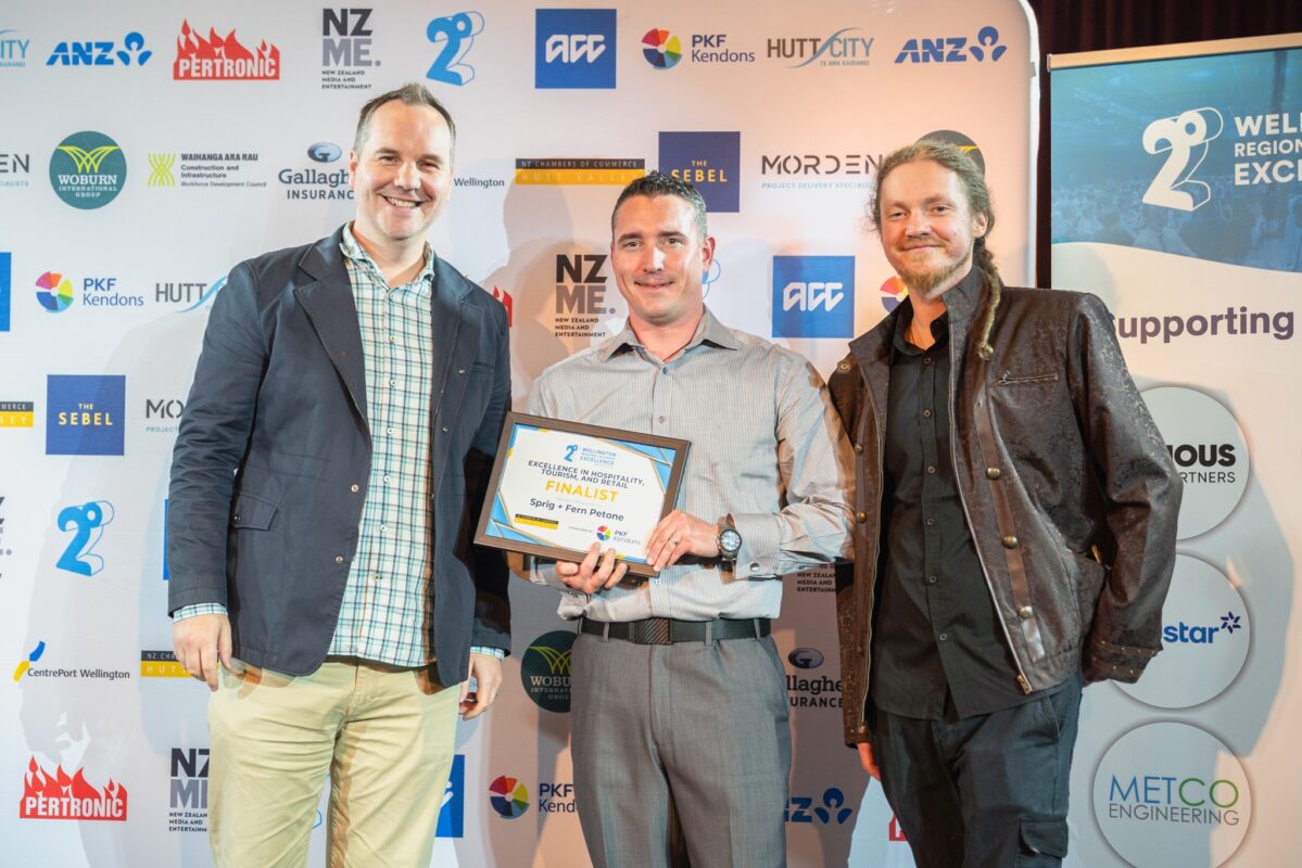 Ian and Ryan of Sprig and Fern Petone being handed a finalist certificate for the 2degrees Wellington Regional Business Excellence Awards.